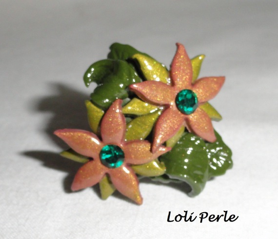 Brown clay flower ring with Swarovski crystal and green foliage