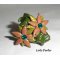 Brown clay flower ring with Swarovski crystal and green foliage