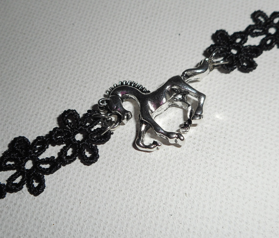 Original bracelet with silver metal horse on black lace