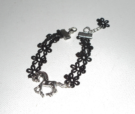 Original bracelet with silver metal horse on black lace