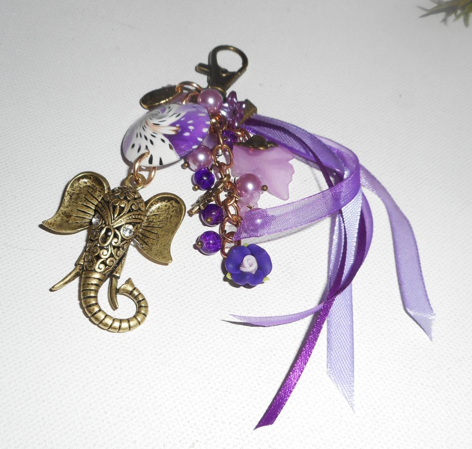 Elephant bag/keychain jewelry with clay beads, glass and purple ribbons