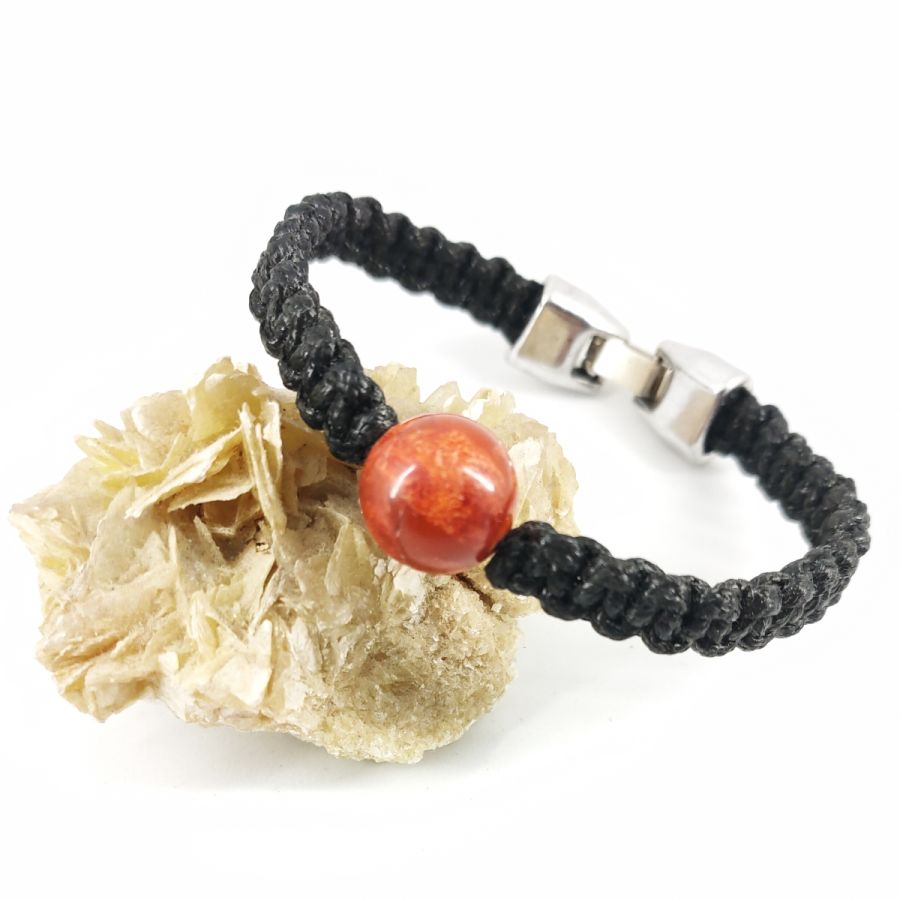 Woven rope bracelet with orange gorgon bead