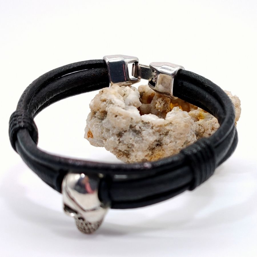 Skull and crossbones bracelet on black leather cords