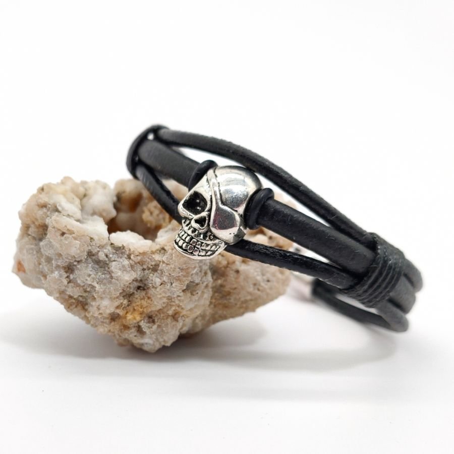 Skull and crossbones bracelet on black leather cords