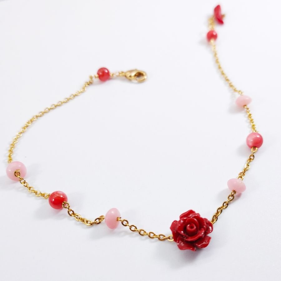 Coral anklet with red rose on gold steel chain