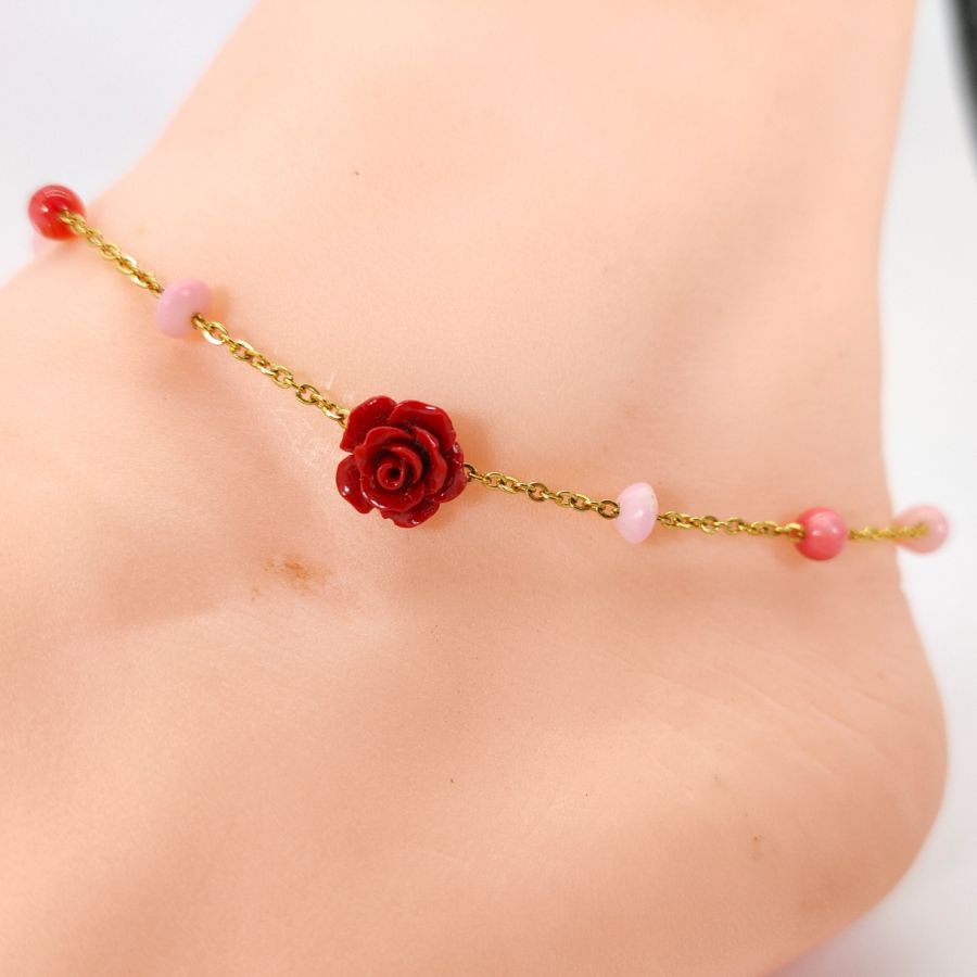 Coral anklet with red rose on gold steel chain