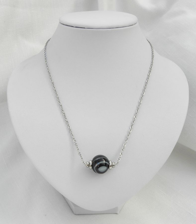 Solitaire necklace with marbled black agate stone and stainless steel beads