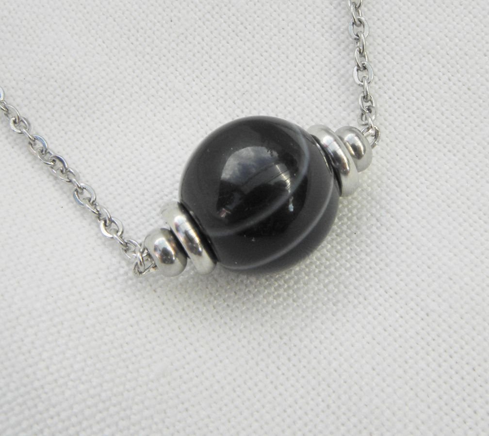 Solitaire necklace with marbled black agate stone and stainless steel beads