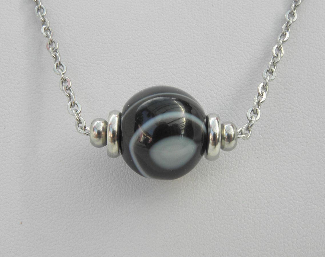 Solitaire necklace with marbled black agate stone and stainless steel beads