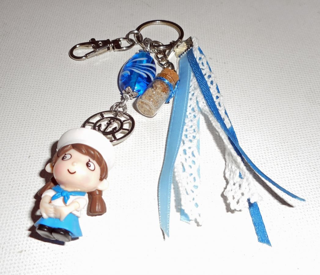 Keychain/Bag jewel with blue glass bead and small sailor with ribbons 