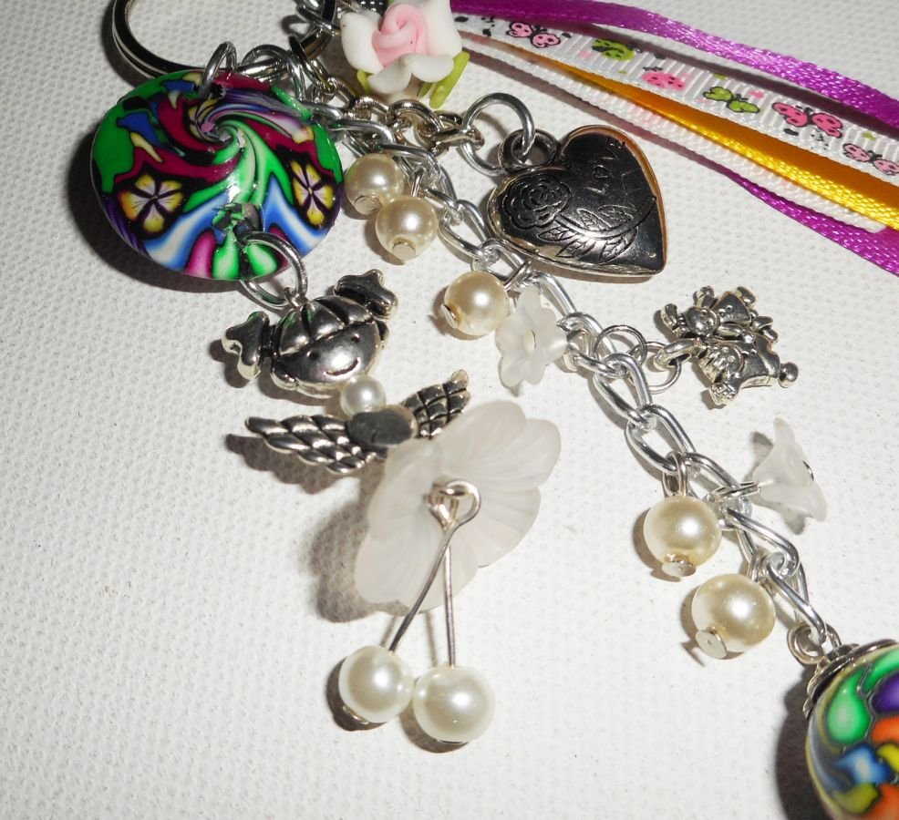 Keychain/Bag jewelry white doll with beads and multicolored ribbons