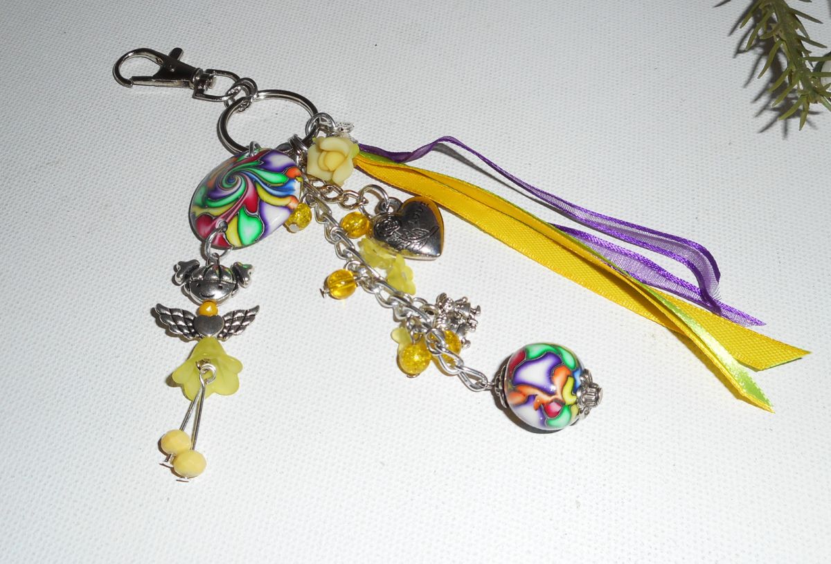 Keychain/Bag jewelry yellow doll with beads and multicolored ribbons