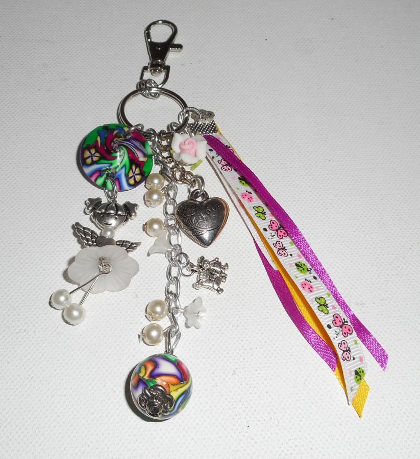 Keychain/Bag jewelry white doll with beads and multicolored ribbons