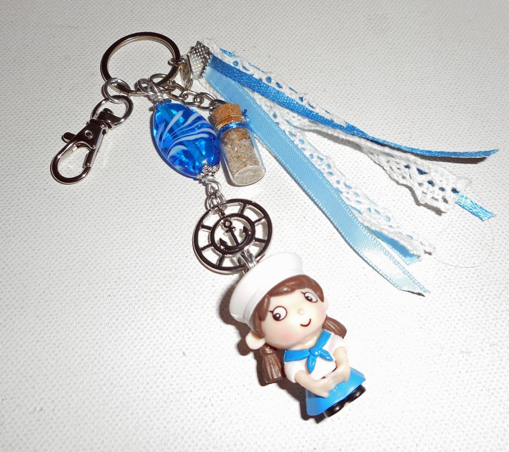 Keychain/Bag jewel with blue glass bead and small sailor with ribbons 