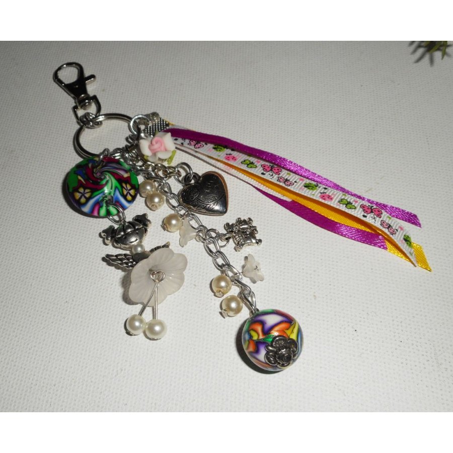 Keychain/Bag jewelry white doll with beads and multicolored ribbons