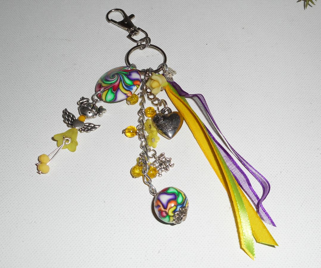 Keychain/Bag jewelry yellow doll with beads and multicolored ribbons