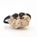 Black stone skull and crossbones bracelet on double rope